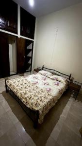 Llit o llits en una habitació de Évasion Urbaine: Charme & Confort à Bujumbura