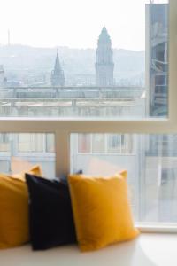 a view of the big ben clock tower through a window at Select Porto Suites in Porto