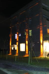 a building with lights on the side of it at night at Minsuku B&B in Taitung City