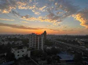 a view of a city at sunset at The Grand hotel and suites studio M Leo in Jaipur