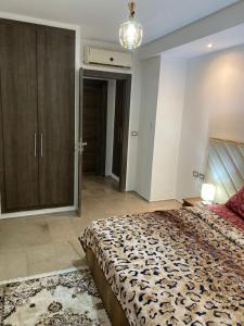 Postel nebo postele na pokoji v ubytování Résidence palmerie 1