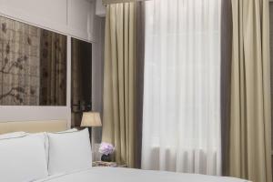 Letto o letti in una camera di The Biltmore Mayfair