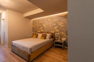Postel nebo postele na pokoji v ubytování Villa Lucrezia - Appartamenti vista Langhe -