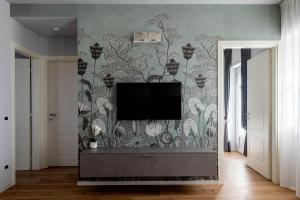TV a/nebo společenská místnost v ubytování Villa Lucrezia - Appartamenti vista Langhe -