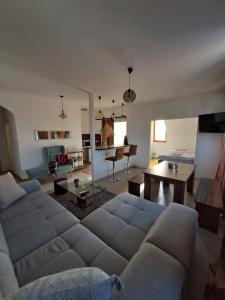 a living room with a couch and a table at Sofi II in Niš