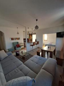 a living room with a couch and a table at Sofi II in Niš