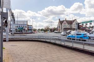 a blue car on a bridge over a street at Contractors 20% Monthly Discounts! WIFI & Parking! in Sheldon