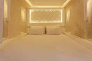 Voodi või voodid majutusasutuse Luxe Nomade Marrakech & Spa toas
