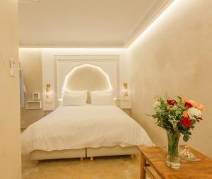Voodi või voodid majutusasutuse Luxe Nomade Marrakech & Spa toas