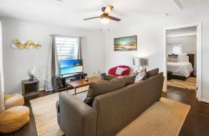 a living room with a couch and a bed at Cozy Heights 2 BD Bungalow, Walkable in Houston