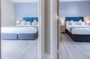 Säng eller sängar i ett rum på Beach Haven Hideout - 2 Bedroom - Milford Haven
