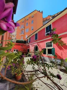 a group of buildings with flowers in front of them at Boutique Hotel Novecento in La Spezia