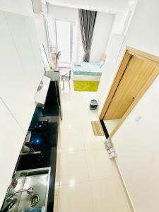 a view of a room with a sink and a bed at Dragonfly Village in Ho Chi Minh City +26 photos