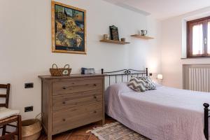 Tempat tidur dalam kamar di Il Nido Toscano