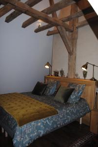 Krevet ili kreveti u jedinici u okviru objekta Suite dans un château dans le Haut Anjou