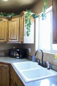 a kitchen with a sink and a microwave at City Lights Retreat in Sheridan