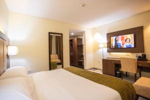 Krevet ili kreveti u jedinici u okviru objekta Jogor Hotel Ibadan