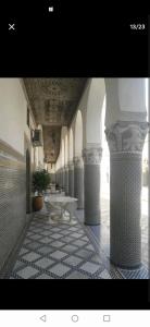a hallway with a table in a building at One bedroom apartement with enclosed garden and wifi at Fes El Bali Fes in Fez