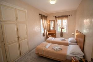 Postel nebo postele na pokoji v ubytování Hotel Argo