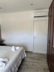 a bedroom with a bed with two towels on it at Pinos del Mar in Huelva