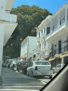 a city street with cars parked on the street at City Center, Special Cosy Home in Tangier