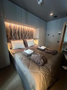 a large bed in a room with lights on it at Snowbird Villas (Arctic Nook) in Kittilä