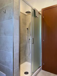 a shower with a glass door in a bathroom at La Luna sul lago in Trevignano Romano +34 photos