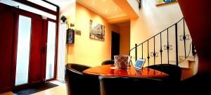 a room with a table with a laptop on it at BUCUR 9 Boutique Hotel in Bucharest