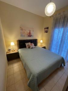Postel nebo postele na pokoji v ubytování Mariposa suites