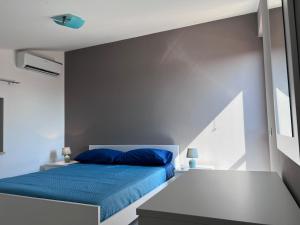 Ένα ή περισσότερα κρεβάτια σε δωμάτιο στο VILLETTA Viale CEFALU