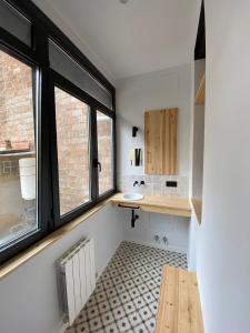a small kitchen with a sink and a window at Poble Sec Charming Apartment in Barcelona