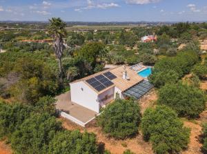 an overhead view of a house with solar panels on the roof at Quinta de Sta Teresa by Villas Key in Lagoa