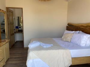 A bed or beds in a room at Coral De Fuego Isla Fuerte