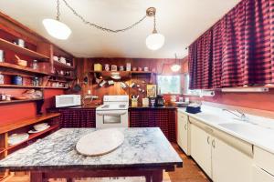 a kitchen with a table and a sink at Honors Nook in Joseph