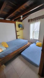 Postel nebo postele na pokoji v ubytování Cabaña Central y Acogedora con Wifi