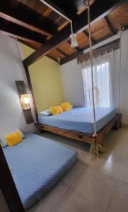 Postel nebo postele na pokoji v ubytování Cabaña Central y Acogedora con Wifi