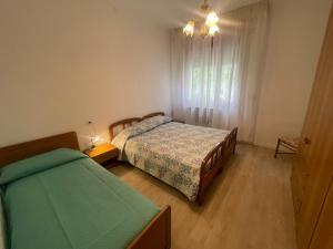 Postel nebo postele na pokoji v ubytování Villa Rita - AGENZIA COCAL