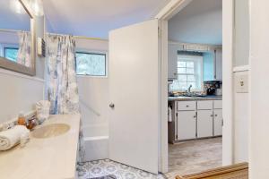 a bathroom with a sink and a mirror at Meet Me At Sea in York +75 photos