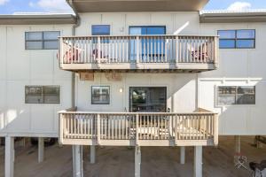 a house with two decks on the side of it at Lei Lani Village 112 by Vacation Homes Collection in Orange Beach
