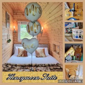a room with a bed with balloons in the shape of a heart at Forester's Retreat Glamping - Cambrian Mountains View in Aberystwyth