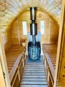 an inside view of a stove in a wooden cabin at Kamienica House 9 in Wągrowiec