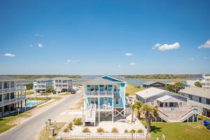 an aerial view of a beach house and a street at Sea-Batical in Oak Island