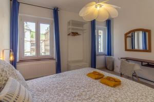 Postel nebo postele na pokoji v ubytování Appartement avec vue sur vignoble
