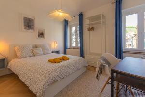 Katil atau katil-katil dalam bilik di Appartement avec vue sur vignoble