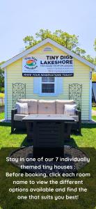a building with a bench in front of a building at Tiny Digs Lakeshore - Tiny House Lodging in Muskegon