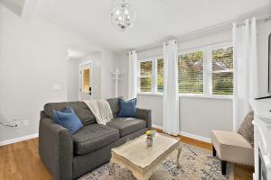 a living room with a couch and a table at Cozy Uptown Guest House in St. Augustine