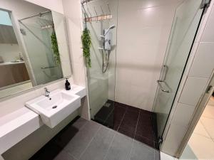 a bathroom with a sink and a shower at BLUE JADE STUDIOS in Tanah Rata