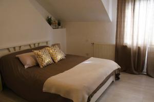 Ένα ή περισσότερα κρεβάτια σε δωμάτιο στο Svila Apartmani