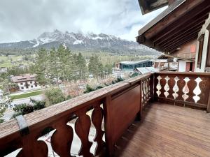 a balcony with a view of a mountain at Classy 4 bedroom few steps from centre in Cortina dʼAmpezzo
