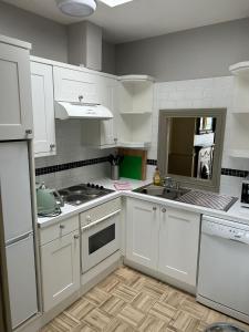 Kuchyň nebo kuchyňský kout v ubytování Gogartys Temple Bar Apartments